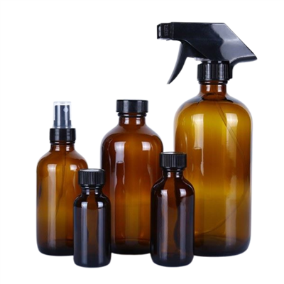 Keltainen lasipullo liipaisumuihkulla